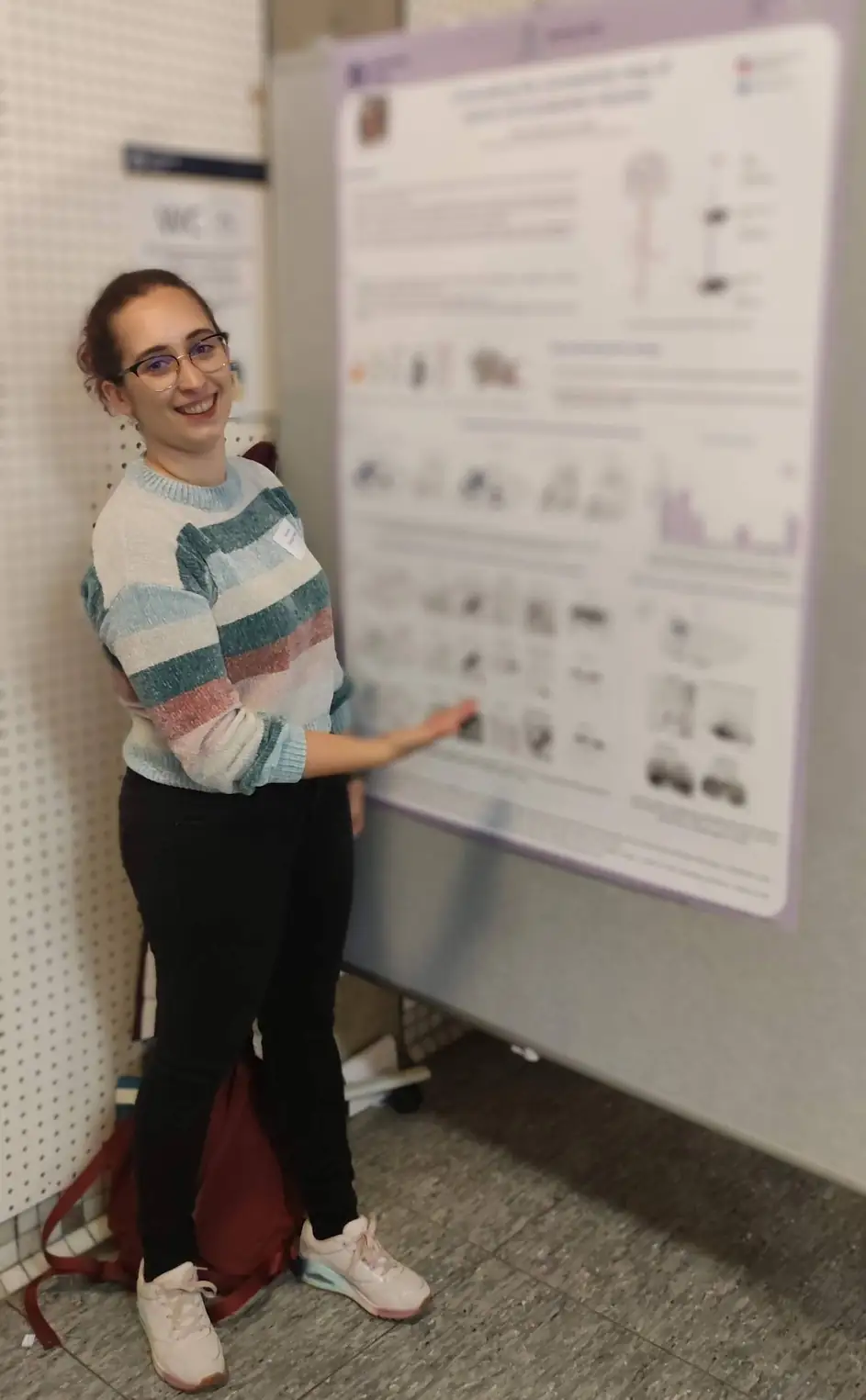 Sandrina presenting a scientific poster at Neuroscience day in Cologne